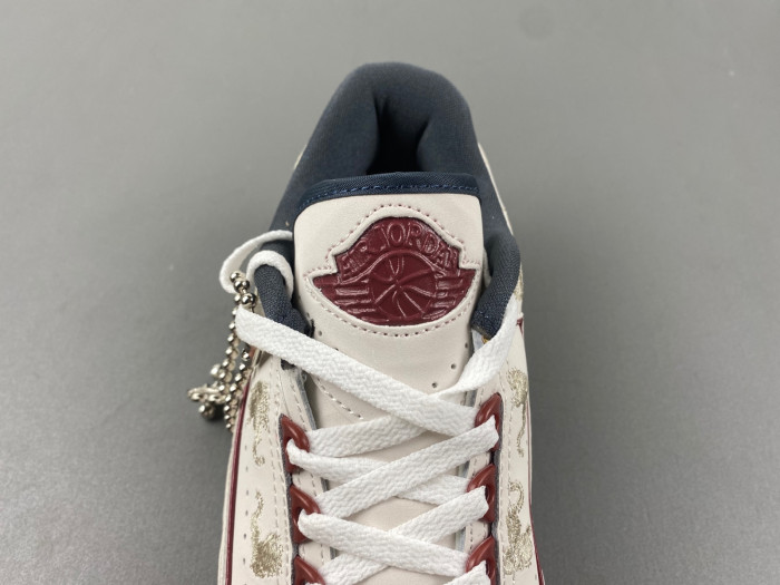 JORDAN 2 RETRO LOW YEAR OF THE DRAGON (WOMEN